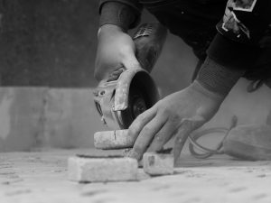 Sydney Builder- black and whie - image - hands drilling